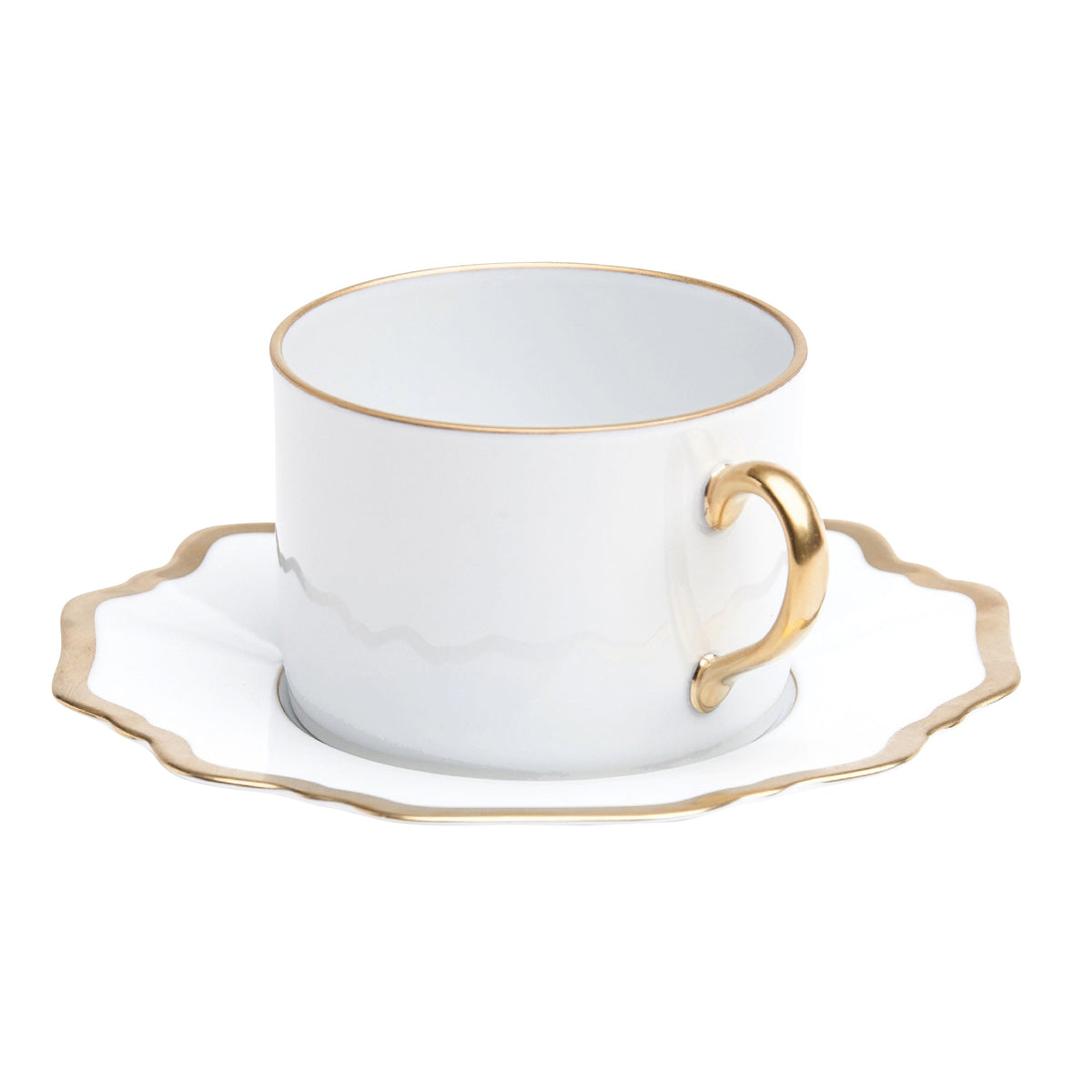 Antique White and Gold Tea Cup and Saucer